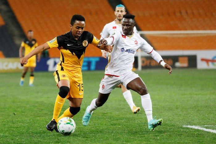 Simon Msuva (R) of Wydad Casablanca pursues  Nkosingiphile Ngcobo (L) of Kaizer Chiefs during a CAF Champions League semi-final second leg at Soccer City stadium in Johannesburg