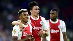 Easy does it: Ajax's David Neres and Steven Berghuis celebrate their fourth goal