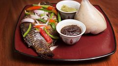 Banku and grilled tilapia with hot pepper