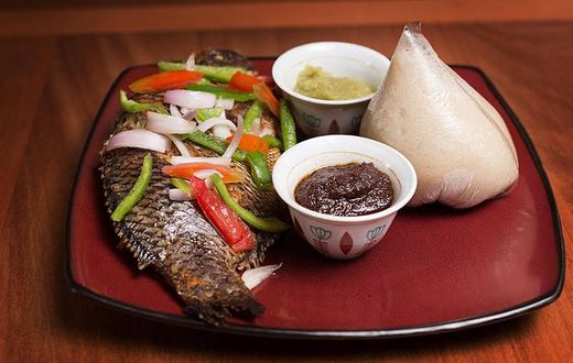 Banku and grilled tilapia with hot pepper