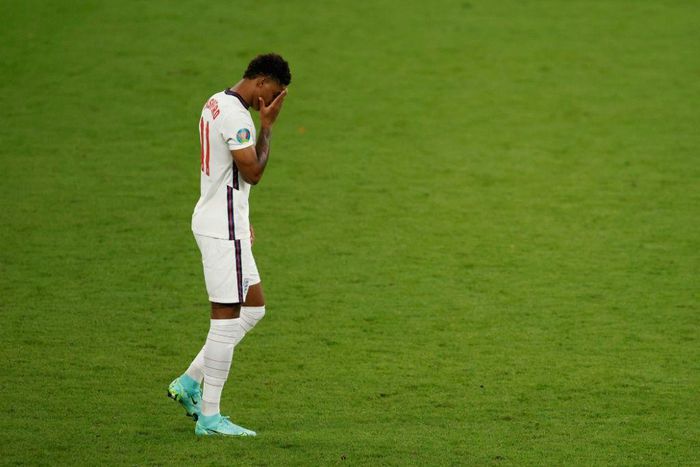 England's forward Marcus Rashford reacts after he fails to score in the penalty shootout during the UEFA EURO 2020 final football match between Italy and England at the Wembley Stadium in London on July 11, 2021