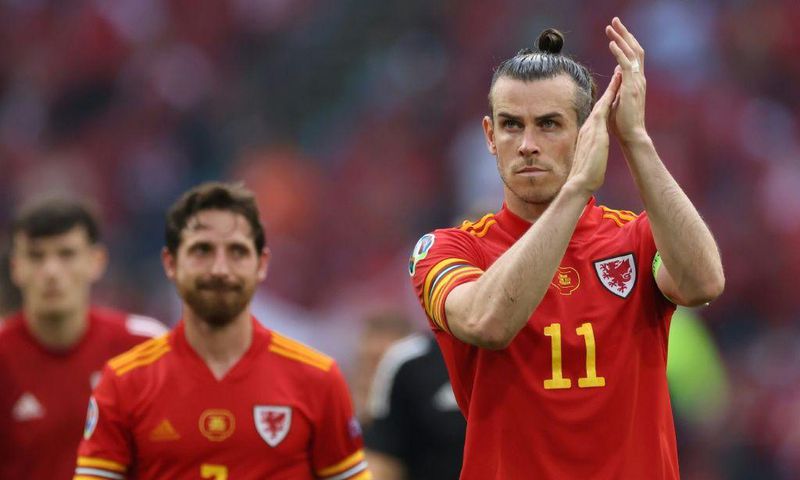 Gareth Bale applauds the travelling Wales fans after the 4-0 loss to Denmark