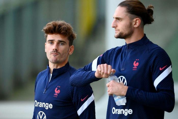 Antoine Griezmann (L) is set to make his 100th France appearance while Adrien Rabiot is out of the Nations League final following a positive Covid-19 test