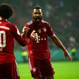 Bayern Munic striker Eric Maxim Choupo-Moting (R) celebrates scoring against Bremer with Leroy Sane