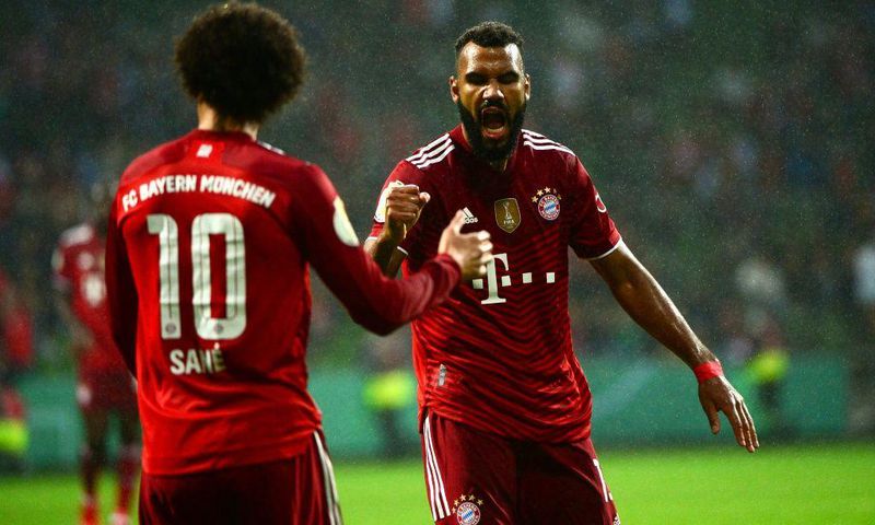 Bayern Munic striker Eric Maxim Choupo-Moting (R) celebrates scoring against Bremer with Leroy Sane