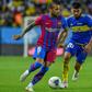 Barcelona's Dani Alves (L) vies for the ball with Boca Juniors' Juan Edgardo Ramirez in the inaugural Maradona Cup friendly in Riyadh.