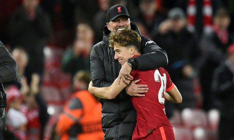 Liverpool manager Jurgen Klopp hugs Kostas Tsimikas after the 2-0 win over Atletico Madrid