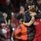 Liverpool manager Jurgen Klopp hugs Kostas Tsimikas after the 2-0 win over Atletico Madrid
