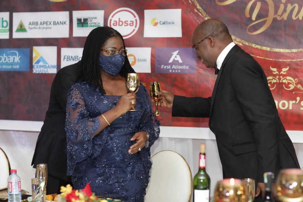 Mrs Elsie Addo Awadzi, right, Second Deputy Governor in a toast with the Dr Ernest Addison, Governor of the Bank of Ghana