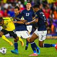 Jamaica's Lamar Walker (left) stumbles as he fights for the ball during the CONCACAF Gold Cup football match between Costa Rica and Jamaica in Orlando, Florida
