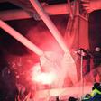 Flares blaze in the stands as the French cup match between Paris FC and Lyon is halted by fleeing fans