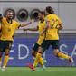 Awer Mabil (L) celebrates with teammates after scoring the opener against China