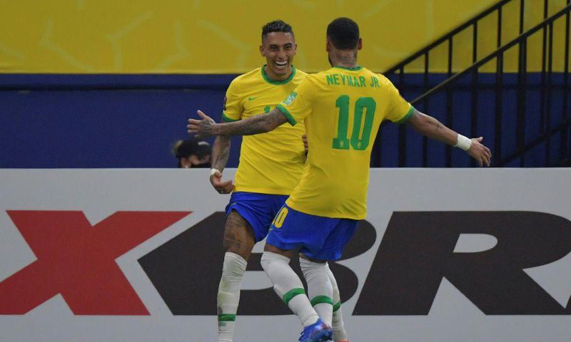 Raphinha (left) celebrates with Neymar after scoring his first goal for Brazil in a 4-1 World Cup qualifier thrashing of Uruguay