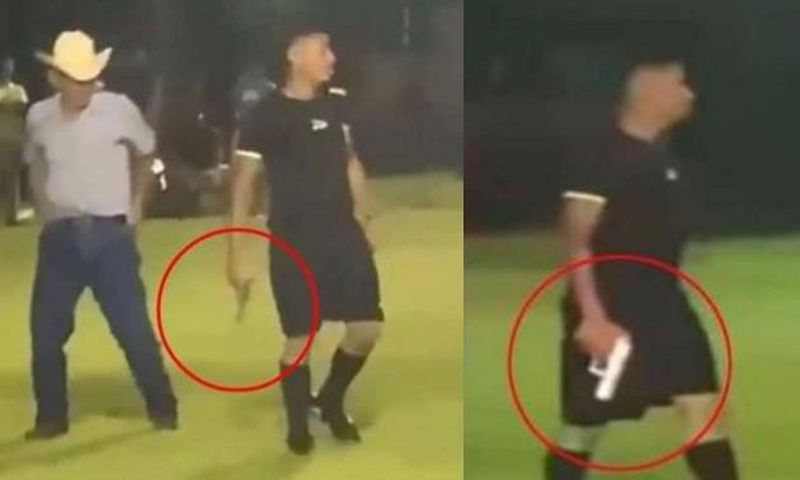 Chaos at football match as referee pulls out gun claiming self-defense