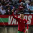 On target: Cristiano Ronaldo celebrates after scoring against Qatar
