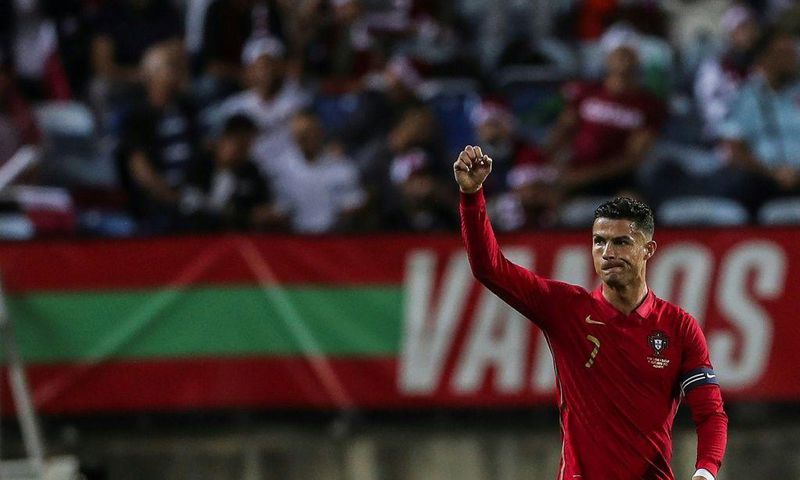 On target: Cristiano Ronaldo celebrates after scoring against Qatar