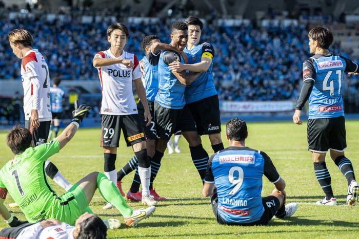 Kawasaki Frontale's Jesiel (C) celebrates after scoring a goal during the J-League football match between Kawasaki Frontale and Urawa Reds in Kawasaki