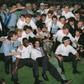 Bernard Tapie, in shirt and tie behind the trophy, poses with the Marseille players who won the 1993 European Cup