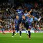 Tinged with sadness: Manchester City's Dutch defender Nathan Ake  jumps to head the ball home