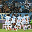 Comeback kings: Marseille celebrate their 3-2 win at Montpellier