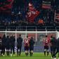 AC Milan's players acknowledge their supporters after defeat to Liverpool and their exit from the Champions League