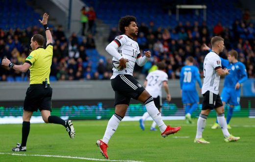 Serge Gnabry celebrates scoring Germany's opening goal against Iceland in Reykjavik