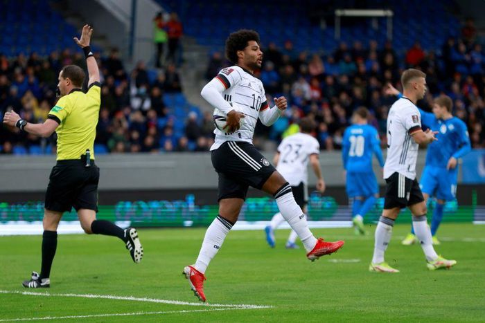 Serge Gnabry celebrates scoring Germany's opening goal against Iceland in Reykjavik