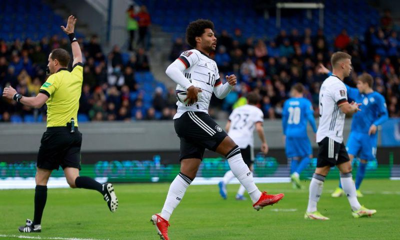 Serge Gnabry celebrates scoring Germany's opening goal against Iceland in Reykjavik