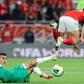 Akram Tawfik (R) of Al Ahly is tackled by Zakaria el Wardi (L) of Raja Casablanca during the CAF Super Cup match in Doha on Wednesday.