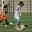 Iraqi girls take part in a football training session at the Bartalla sports club, in the former jihadist stronghold of Bartalla