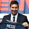 Welcome to Paris: Lionel Messi poses as he holds-up his number 30 shirt