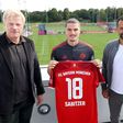 Bayern Munich new signing Marcel Sabitzer (C) flanked by club CEO Oliver Kahn (L) and sports director Hasan Salihamidzic (R)