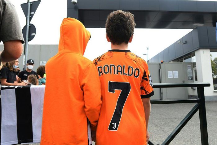 Juventuss fans wait for Cristiano Ronaldo outside the club's Continassa training centre in Turin on Friday