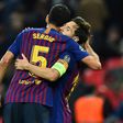 Sergio Busquets congratulates Lionel Messi on a Champions League goal in 2018