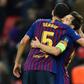 Sergio Busquets congratulates Lionel Messi on a Champions League goal in 2018
