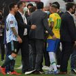 Argentina's Lionel Messi (L) and Brazil's Neymar are seen after the two teams' World Cup qualifier was halted by Brazilian health officials in Sao Paulo