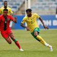Andre-Frank Zambo Anguissa (R) of Cameroon and Gerald Phiri (L) of Malawi seek possession during a 2022 World Cup qualifier in Soweto on Saturday.