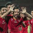 Defender Ali Maaloul (C) and teammates from Egyptian club Al Ahly celebrate a goal en route to winning the 2021 CAF Champions League