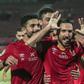 Defender Ali Maaloul (C) and teammates from Egyptian club Al Ahly celebrate a goal en route to winning the 2021 CAF Champions League