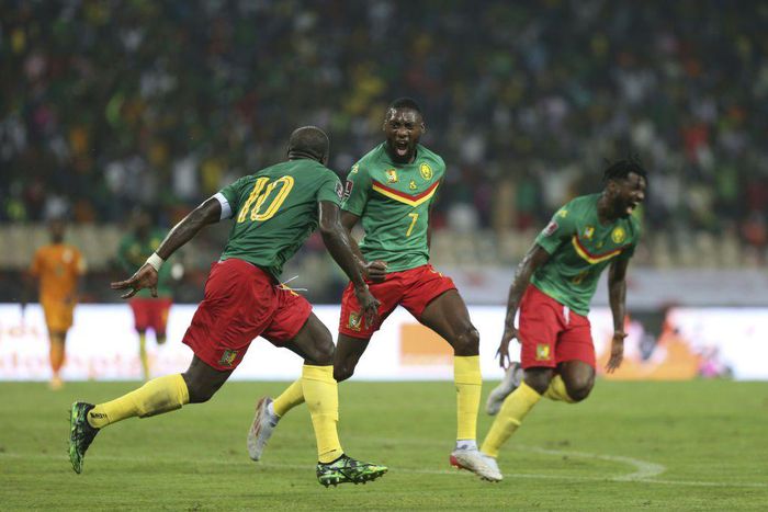 Cameroon forward Karl Toko Ekambi (C) celebrates after scoring the goal that beat the Ivory Coast on Tuesday in a World Cup qualifier in Yaounde