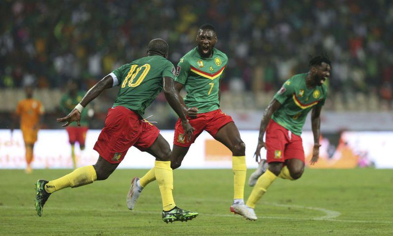Cameroon forward Karl Toko Ekambi (C) celebrates after scoring the goal that beat the Ivory Coast on Tuesday in a World Cup qualifier in Yaounde