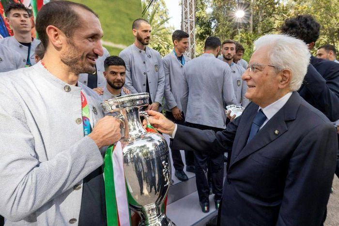 Italy's President Sergio Mattarella (R) congratulating captain Giorgio Chiellini on their Euro 2020 victory