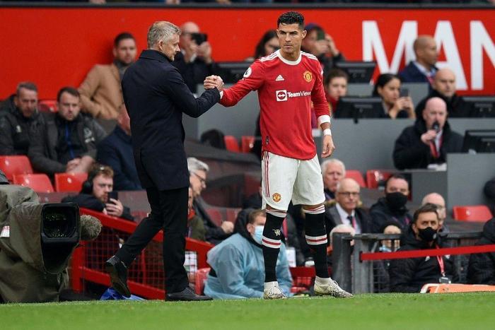 Ole Gunnar Solskjaer (left) started Cristiano Ronaldo (right) on the bench for Manchester United's 1-1 draw with Everton