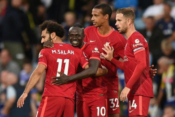 Liverpool's Sadio Mane (C) celebrates with Mohamed Salah (L)