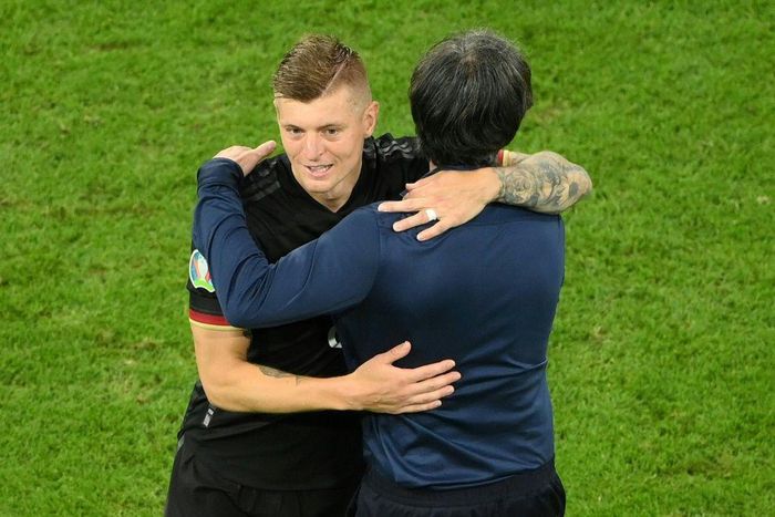 Toni Kroos hugs head coach Joachim Loew after Germany's 2-2 draw with Hungary put them in the last 16 of Euro 2020