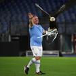 Juan Bernabe holds Lazio mascot Olimpia before their Europa League match with Lokomotiv Moscow
