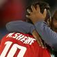 Al Ahly coach Pitso Mosimane (R) celebrates with star forward Mohamed Sherif (L) after the Egyptian club won the CAF Super Cup last May.