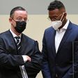 Former Bayern Munich defender Jerome Boateng (R) and his lawyer Kai Walden in court in Munich