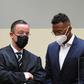 Former Bayern Munich defender Jerome Boateng (R) and his lawyer Kai Walden in court in Munich