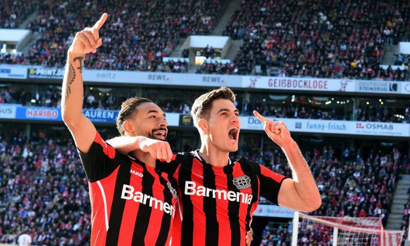 Leverkusen's Czech forward Patrik Schick (R) scored four goals on Saturday